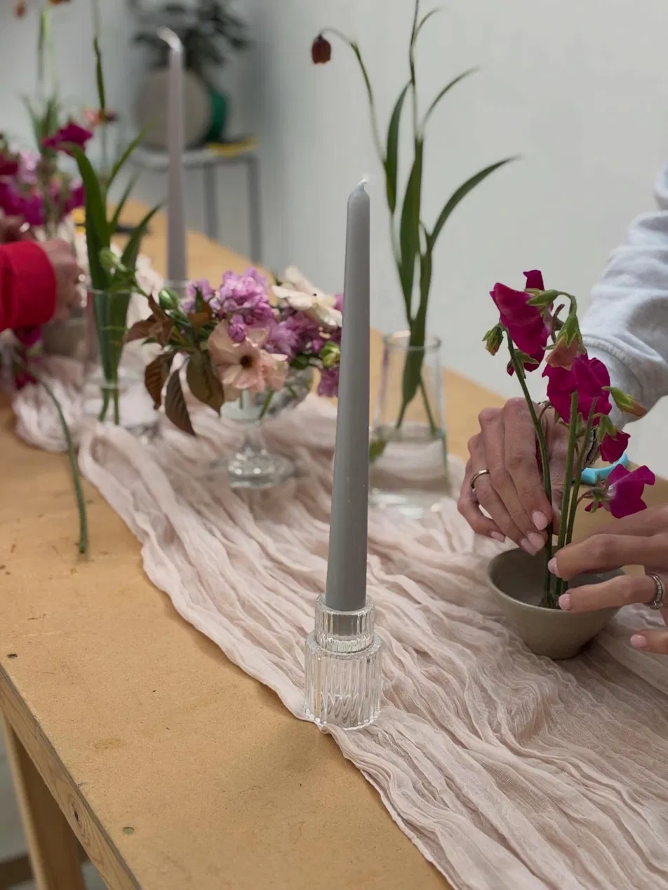Sweet peas being arranged at a tablescaping workshop